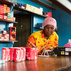 Small shop owner counting money